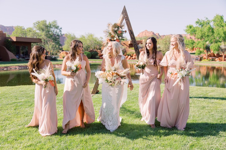 Bride walking with bridesmaids