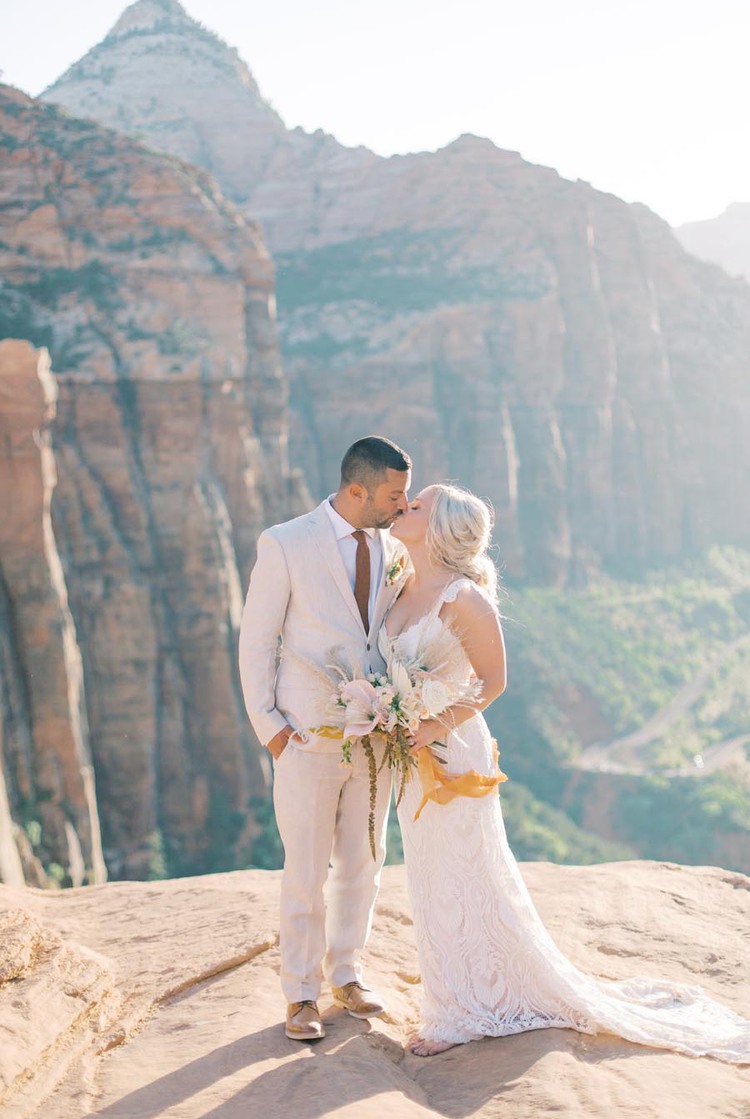 Couple kiss on cliff