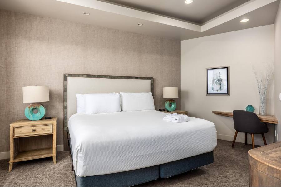 Spacious desert-inspired suite with natural light and comfortable seating at a luxury resort in St. George.