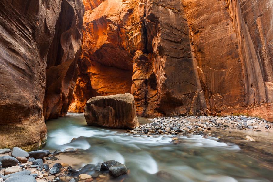 Dramatic canyon walls and hiking trails inside Zion National Park near St. George, a popular Southern Utah day trip.